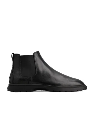 Tod's Tronchetto Slip-on Leather Boots In Black