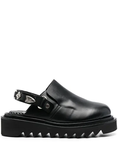 TOGA BUCKLED ANKLE-STRAP FLAT CLOGS