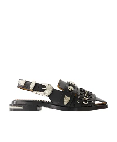 Toga Exposed Heel Flat Shoes In Black