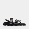 Toga Sandales Plates En Cuir Noir Avec Détails Métallisés In Black