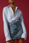 Tommy Jeans Izzie Embroidered Crest Logo Denim Mini Skirt In Tinted Denim, Women's At Urban Outfitters In Tinted Denim