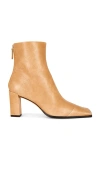 Tory Burch Asymmetric Cap Toe Ankle Boot In Sand