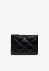 Tory Burch Kira Quilted Leather Pouch Bag In Black
