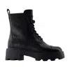 Tory Burch Monogram-embossed Lug Sole Ankle Boot In Animal Print