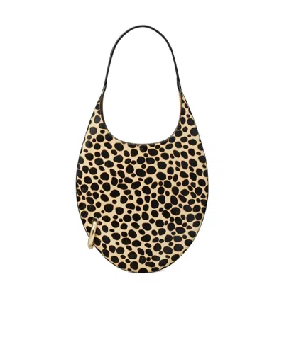 Tory Burch Pierced Calf Hair Handbag In Black