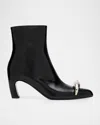 Tory Burch Pierced Leather Ankle Boots In Black