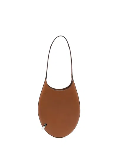 Tory Burch Small Pierced Shoulder Bag In Brown