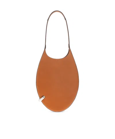 Tory Burch Small Pierced Shoulder Bag In Brown