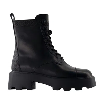 Tory Burch T-monogram Lug Ankle Boots In Black