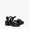 Tory Burch Turnlock Lug Heeled Sandal In Black