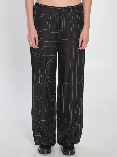 Totême Toteme Black Monogram Silk Pajama Trousers
