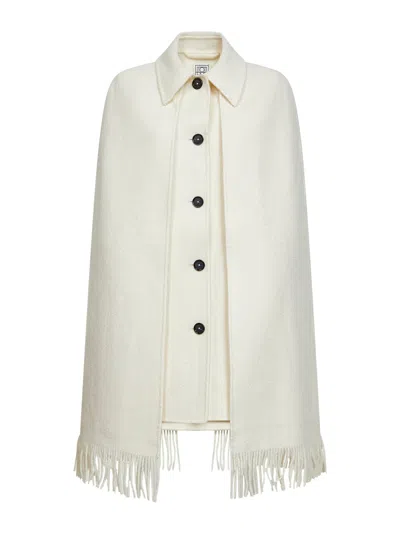 Totême Toteme Bouclé Wool With Fringe Trim Cape In Ivory