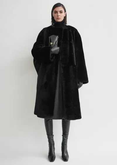 Totême Collarless Shearling Coat Black