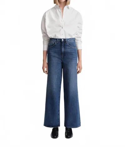 Totême Flare Fit Jeans In Washed Blue