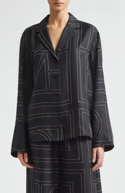 Totême Toteme Monogram Embroidered Organic Silk Pajama Top In Black