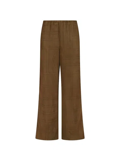Totême Monogram Flannel Trousers In Brown