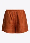 Totême Monogram Silk Mini Shorts In Brown