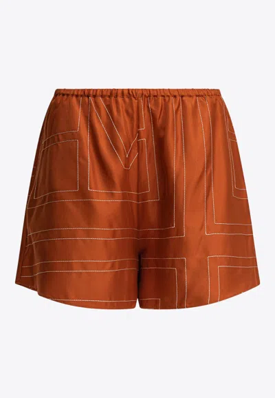 Totême Monogram Silk Mini Shorts In Brown