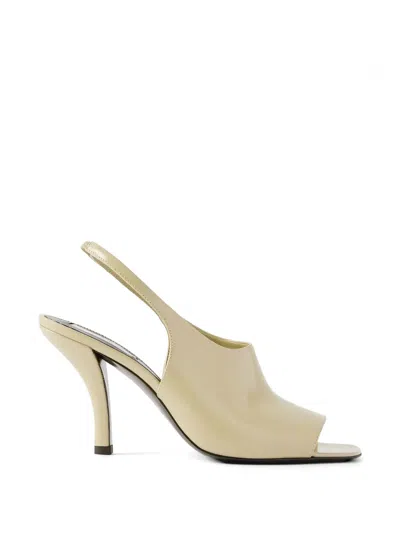 Totême Glossed-leather Sandals In Neutral