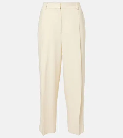 Totême Pleated Low-rise Straight Pants In Yellow