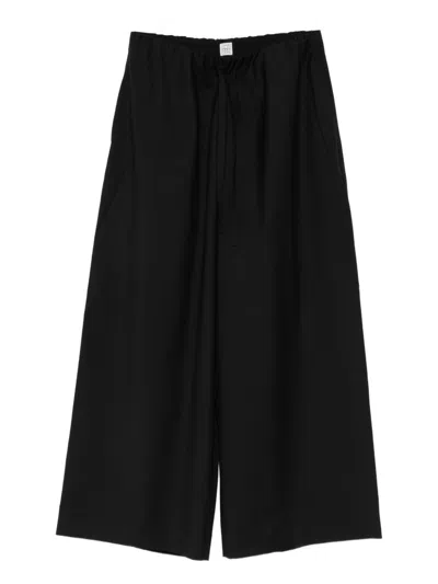 Totême Toteme Pre Wool Drawstring Trousers In Black