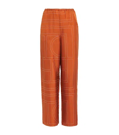 Totême Silk Embroidered Monogram Trousers In Brown
