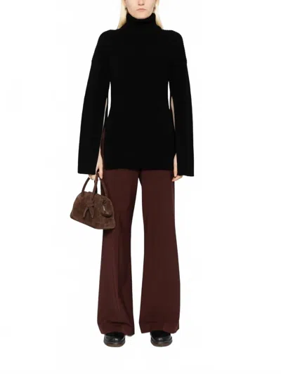 TOTÊME SLIT SLEEVE KNIT SWEATER IN BLACK