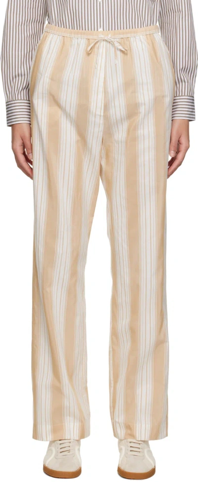 Totême Stripe Press-creased Drawstring Trousers In Sand Dune Stripe