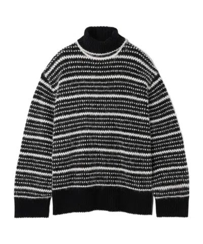 Totême Scandi Wool-blend Turtleneck Sweater In Black