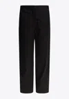 Totême Twisted Seam Tailored Pants In Black