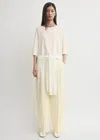 Totême Wide Fluid Trousers Ecru In Sand