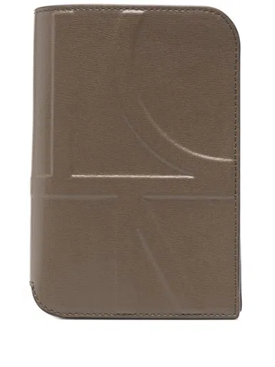 Totême Embossed-monogram Passport Holder In Brown