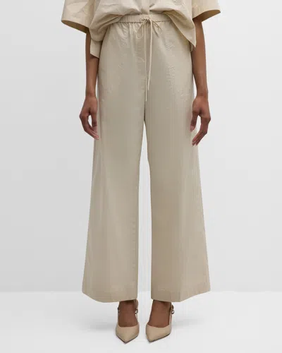 Totême High-rise Wide-leg Cotton Drawstring Trousers In Light Beige