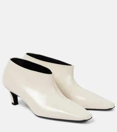 Totême The Wide Shaft Glossed-leather Ankle Boots In Beige