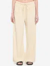 Totême Press-creased Drawstring Trousers In Beige