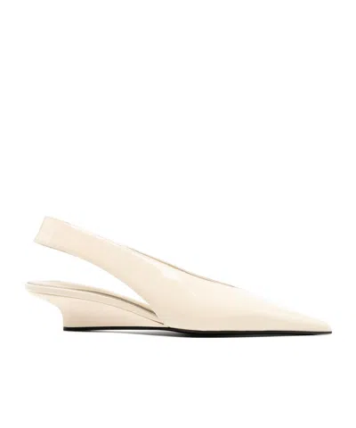 Totême The Wedge-heel Pumps In Nude