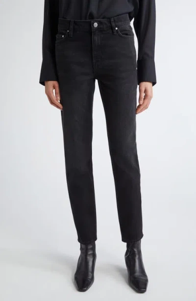 Totême Toteme Low Rise Tapered Leg Jeans In Faded Black