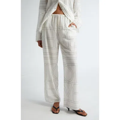 Totême Toteme Monogram Embroidered Pull-on Pants In White/black