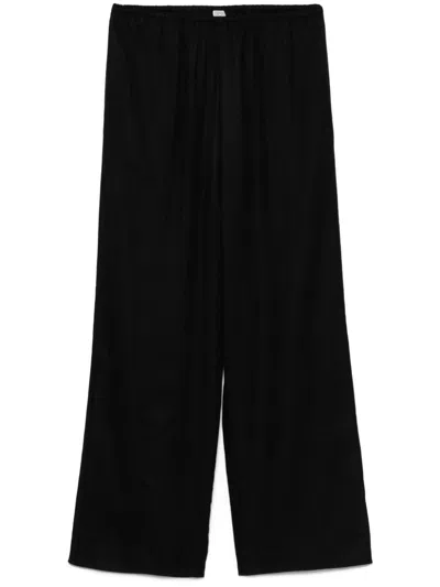 Totême Monogram Flannel Trousers In Multicolor