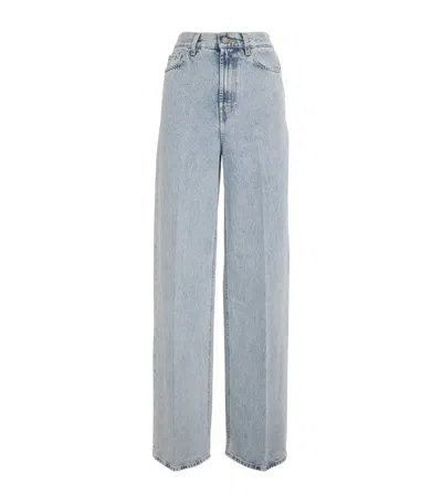Totême Light Blue Wide Jeans With Logo Patch