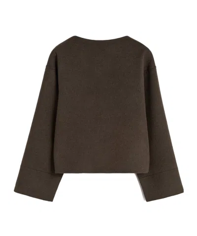 Totême Wool Long-sleeved Sweater In Black