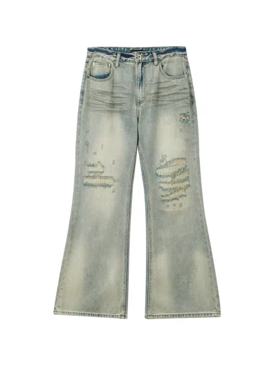 Tout A Coup Distressed Flared Jeans In Blue