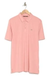 Travismathew The Heater Solid Short Sleeve Performance Polo In Heather Blush