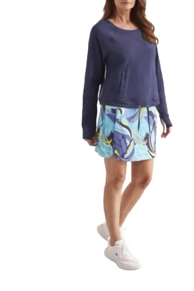 TRIBAL PRINTED PULL ON SKORT WITH ROUNDED HEM IN JET BLUE