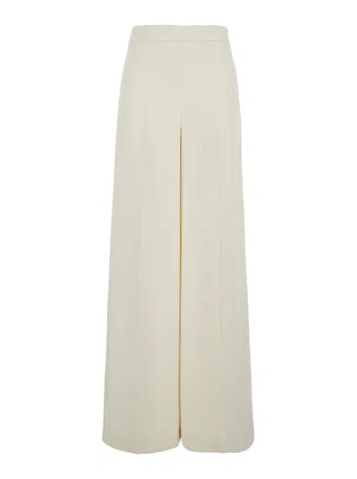 TWINSET BEIGE PANTS WITH LOGO PENDANT AND SIDE ZIP CLOSURE IN TECH FABRIC WOMAN