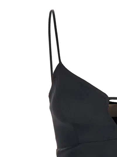 TWINSET BLACK LONG DRESS WITH THIN SHOULDER STRAPS AND METALLIC LOGO PLAQUE ON THE BACK IN TECH FABRIC WOMAN