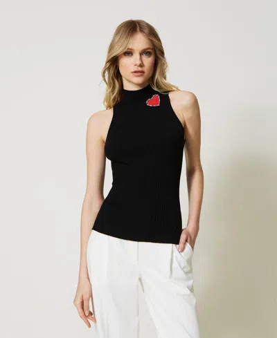 Twinset Top En Maille Rayée Avec Broche In Black
