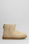 Ugg Classic Mini Low Heels Ankle Boots In Leather Color Suede In Beige