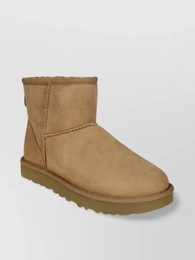 Ugg Classic Mini Ii Suede Ankle Boots With Shearling Lining In Brown