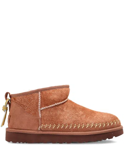 Ugg Mini Soft Suede Slip-on Boots With Decorative Stitching In Brown